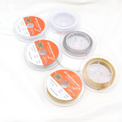 White, steel-colored and gold-tone beading wire spools displayed front and back on a white background.