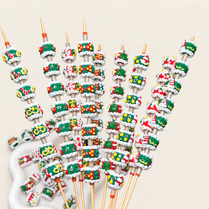 Christmas 3D hand painted bead assortment on upright display rods and ceramic tray