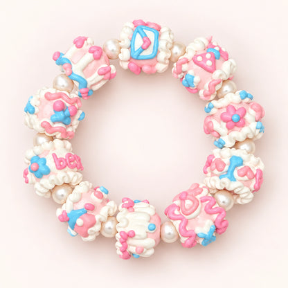 Finished handmade bracelet design with pink and blue hand-painted 3D beads and pearl-style spacers